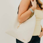 Vegan leather hobo tote bag with an exterior lock