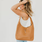 Vegan leather hobo tote bag with an exterior lock