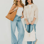 Vegan leather hobo tote bag with an exterior lock