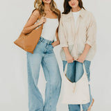 Vegan leather hobo tote bag with an exterior lock