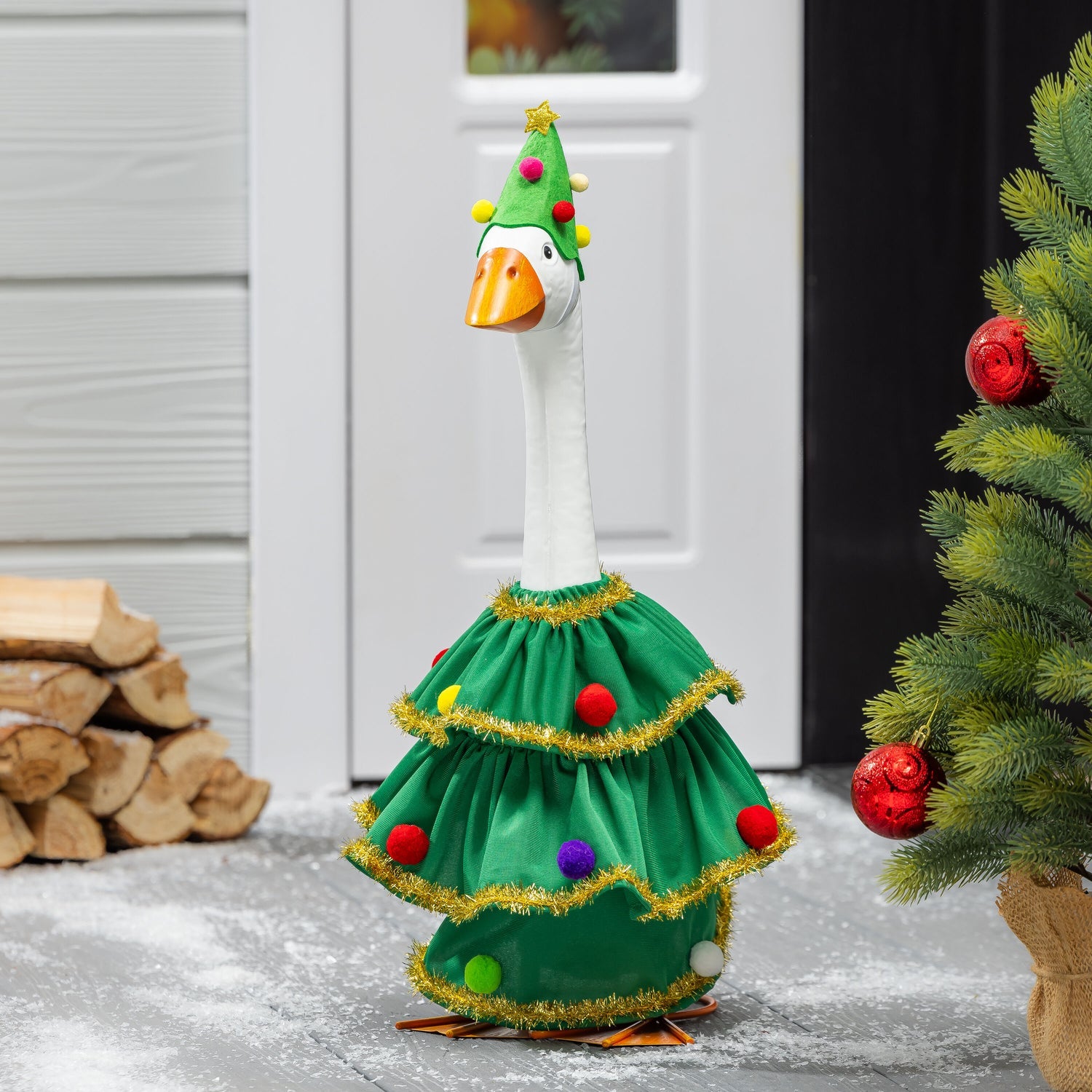 Porch goose in a Christmas tree outfit
