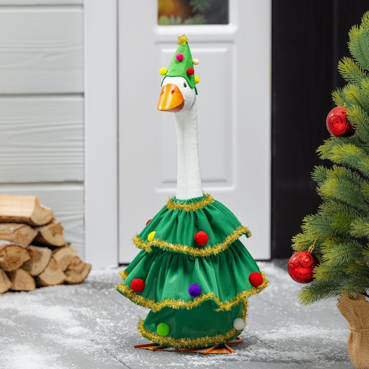 Porch goose in a Christmas tree outfit