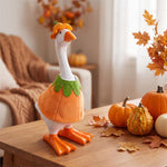 Table-sized goose figurine dressed in a holiday outfit