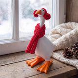 Table-sized goose figurine dressed in a holiday outfit