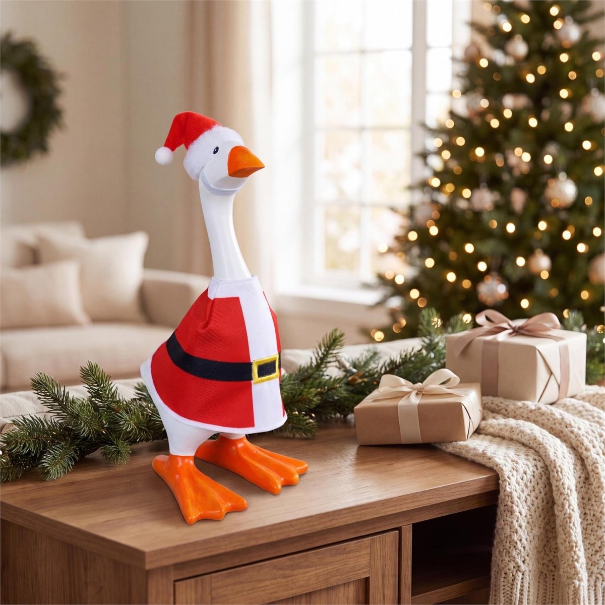 Table-sized goose figurine dressed in a holiday outfit