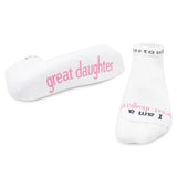 White socks with pink text on a white background