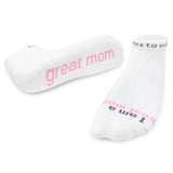 White socks with pink text on a white background