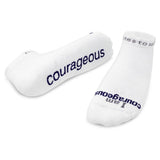 Two white socks with 'Courageous' text on a white background
