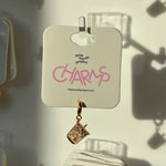 Gold iced coffee charm on a 'little words project' card with pink text