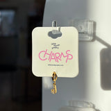 Gold J charm on a 'little words project' card with pink text.