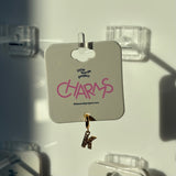 Gold charm with 'K' on a 'little words project 