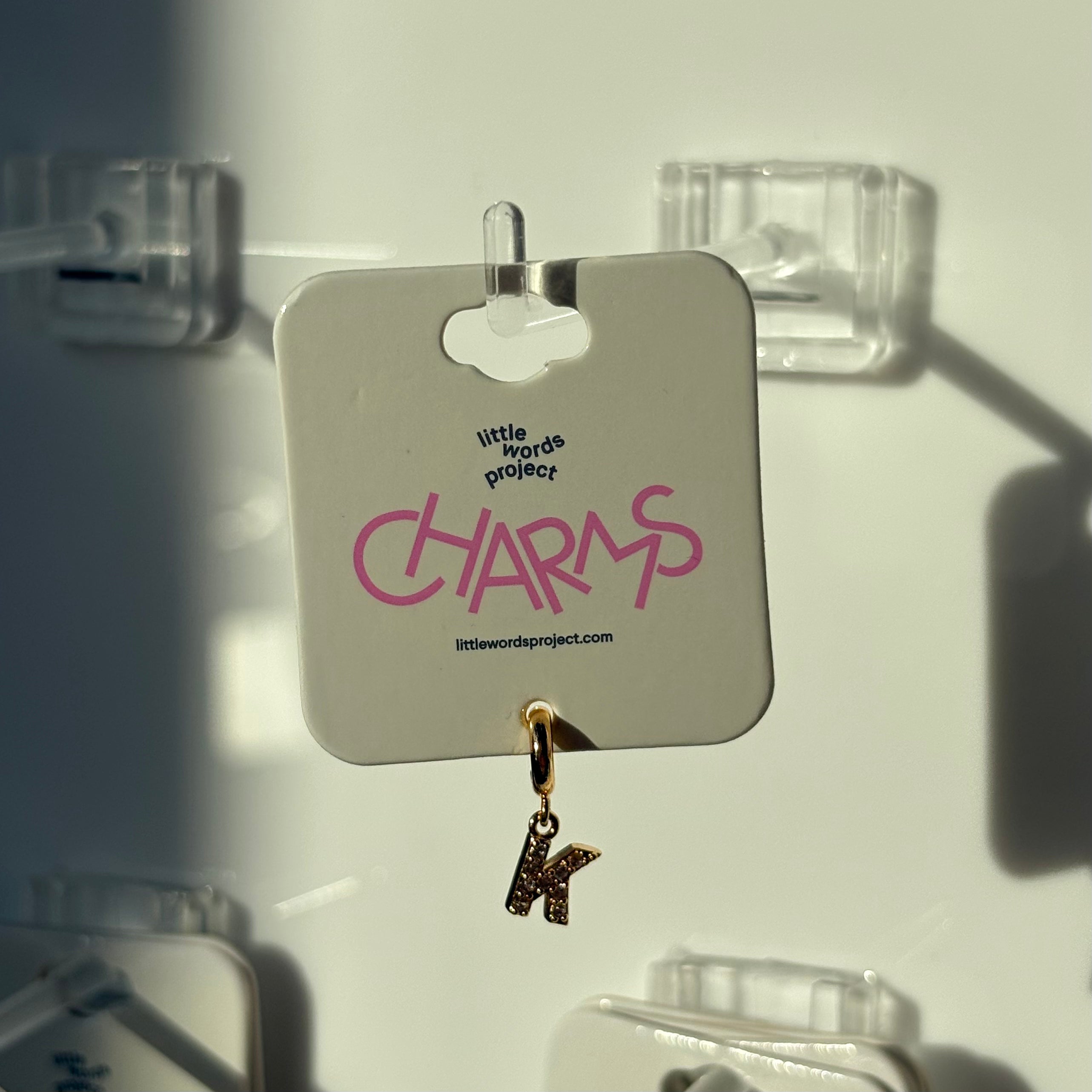 Gold charm with 'K' on a 'little words project 