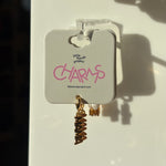 Gold mama charm on a display card with 'little words project' branding.