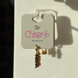 Gold mama charm on a display card with 'little words project' branding.