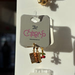 Set of orange crate charms on a card with 'little words project' branding