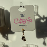 Gold number 4 charm with number '4' on a 'little words project' card.