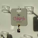 Gold number 6 charm on a display card with 'little words project' branding.