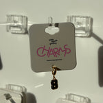 Earring on a display card with 'little words project CHARMS' number 8 branding.