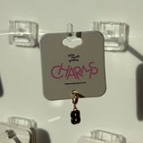 Earring on a display card with 'little words project CHARMS' number 8 branding.