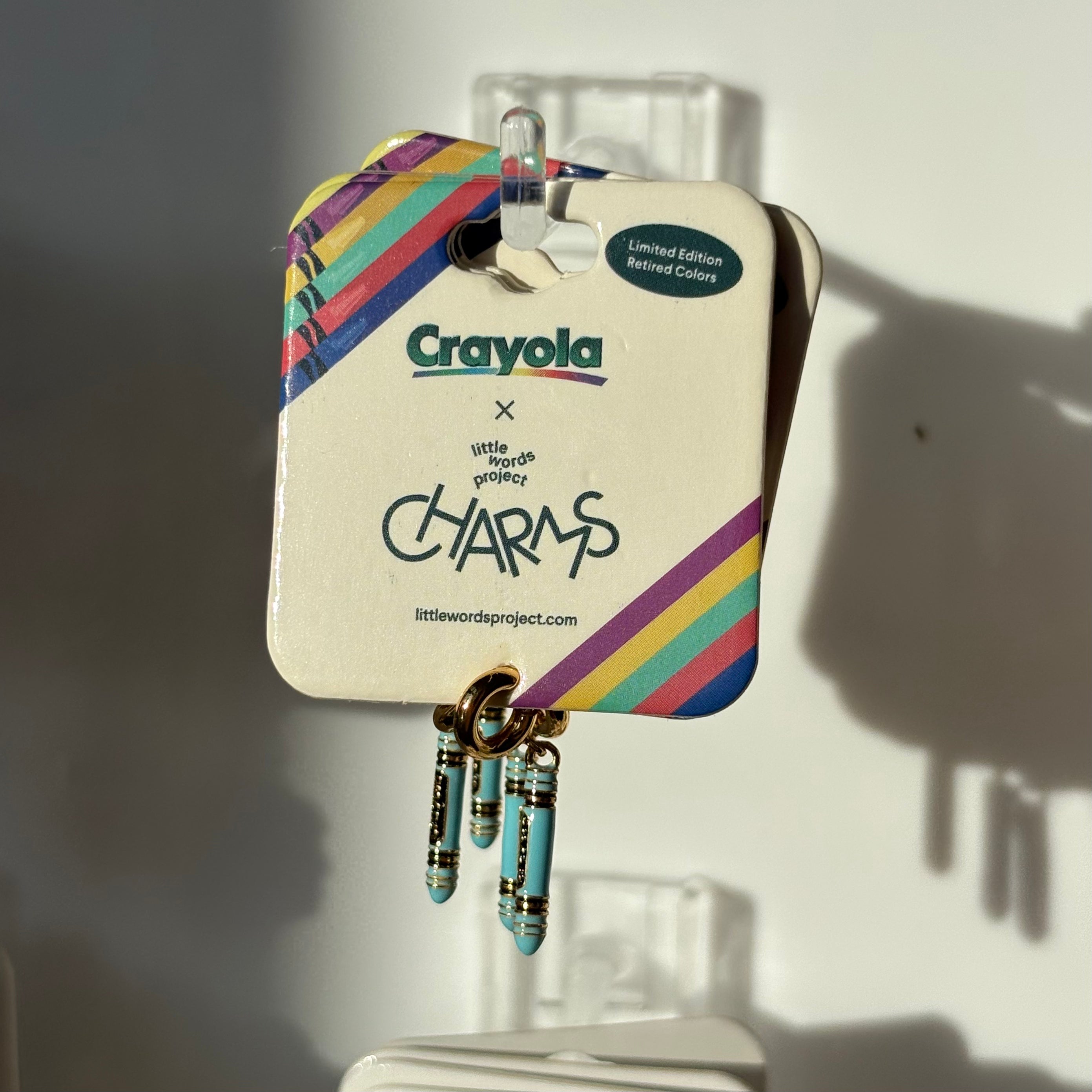Crayola blizzard blue charm on a white background