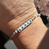 Little words bracelet with 'GRACE' beads on a wrist