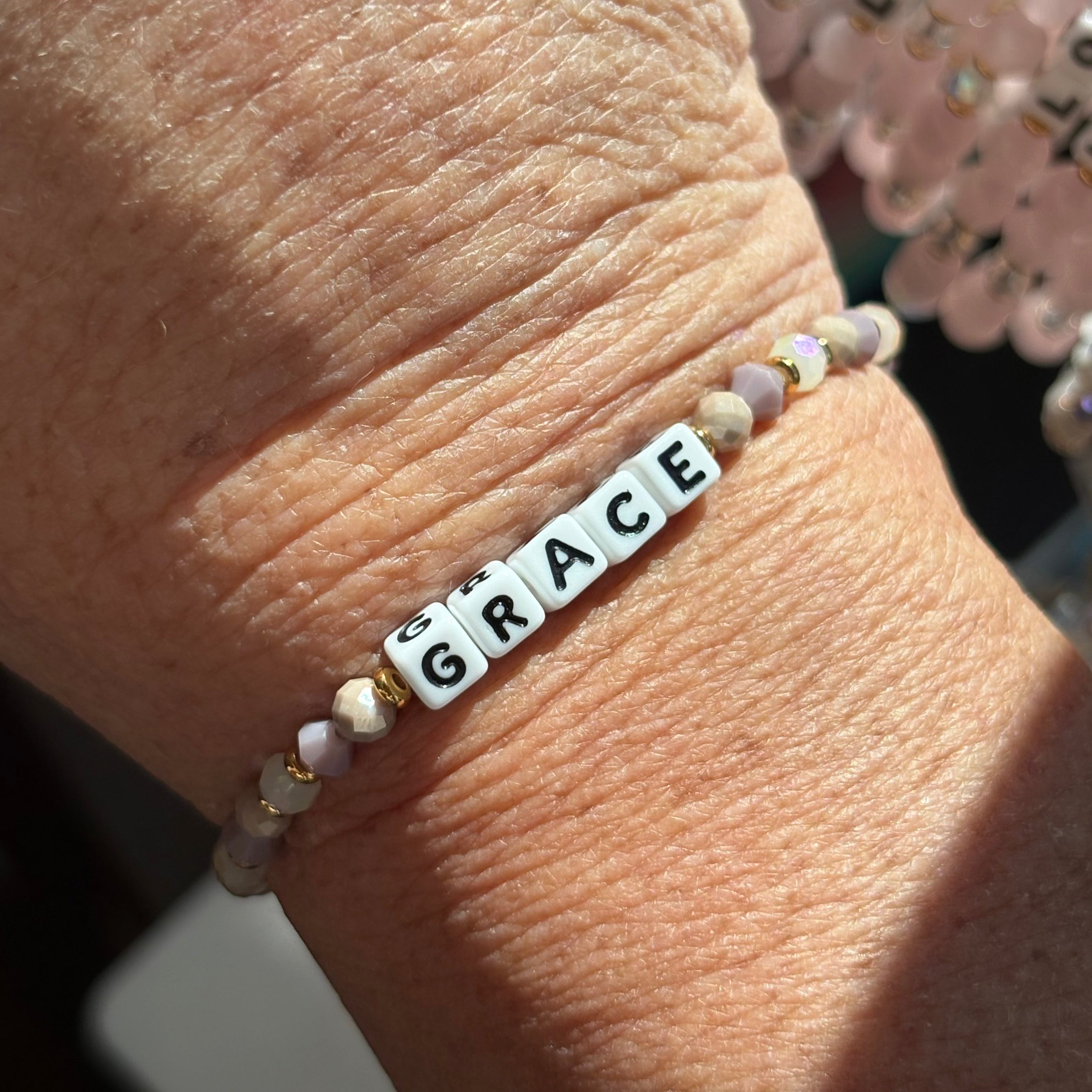 Little words bracelet with 'GRACE' beads on a wrist