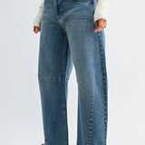 Medium wash barrel jeans with seam detailing and a raw hem