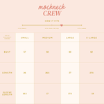 Size chart for 'mockneck CREW' with measurements in inches on a light pink background.