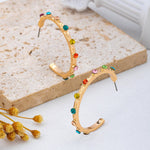 Multi-color gemstone hoop earrings in gold-tone
