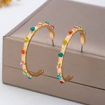 Multi-color gemstone hoop earrings in gold-tone