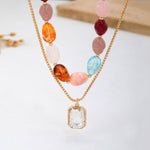 Multi-color stone and crystal pendant necklace in green, pink, and burgundy