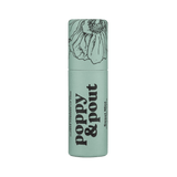 Lip balm container with 'Poppy & Pout' branding on a green background