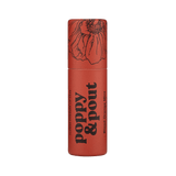 Lip balm container with floral design and 'Poppy & Pout' branding on a green background