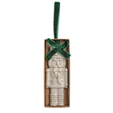 Ceramic nutcracker ornament with reactive glaze and a velvet ribbon bow
