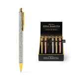 An Olivia Moss Glitter Bomb pen filled with floating glitter