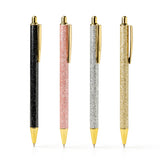An Olivia Moss Glitter Bomb pen filled with floating glitter