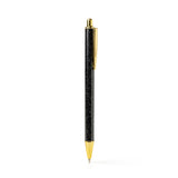 An Olivia Moss Glitter Bomb pen filled with floating glitter