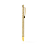 An Olivia Moss Glitter Bomb pen filled with floating glitter