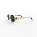 Oval sunglasses with a gold frame and brown lenses
