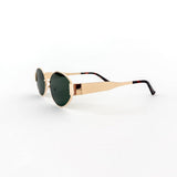 Oval sunglasses with a gold frame and brown lenses