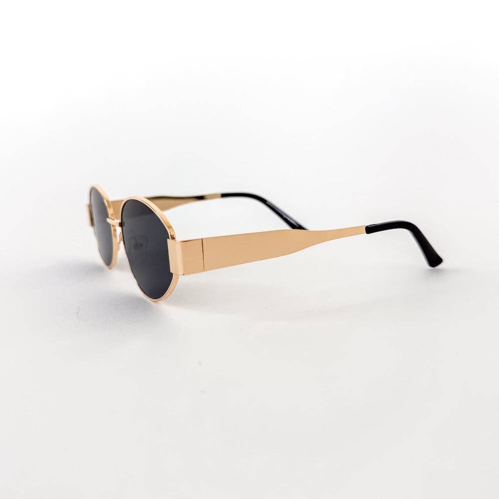 Oval sunglasses with a gold frame and brown lenses