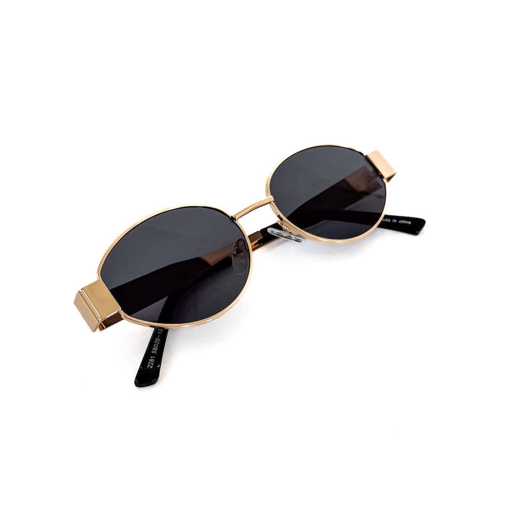 Oval sunglasses with a gold frame and brown lenses