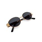 Oval sunglasses with a gold frame and brown lenses