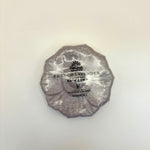 French Lavender bath bomb wrapped in silver foil on a light beige background