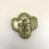 Cactus santal and amber bath bomb with 'Pacha Soap Co' branding on a beige background