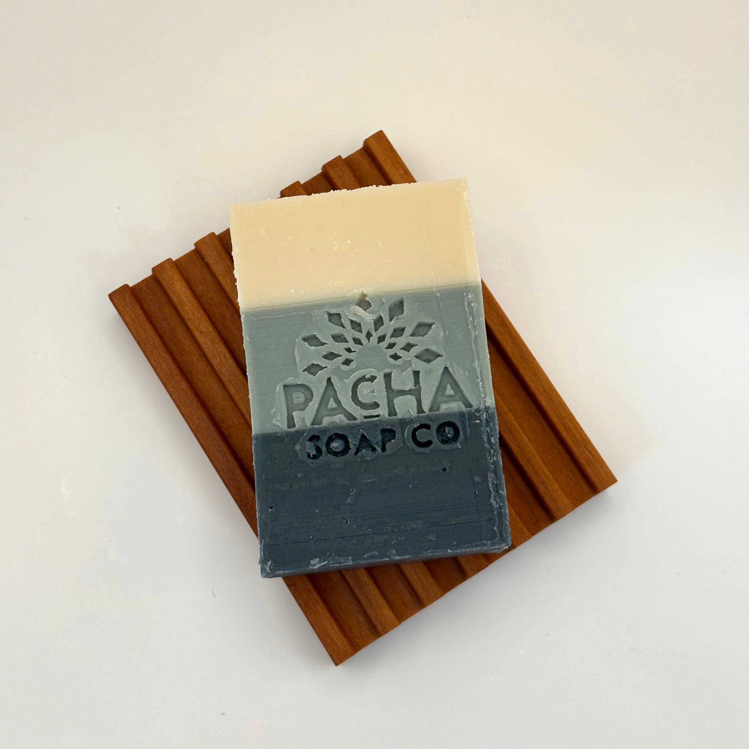 Bar of sea salt and moss soap with 'Pacha Soap Co' branding on a white background