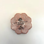 White blossom and fig bath bomb with 'Pacha Soap Co.' branding on a light background