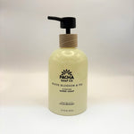 White Blossom and fig soap bottle with wooden pump from Pacha Soap Co on a white background