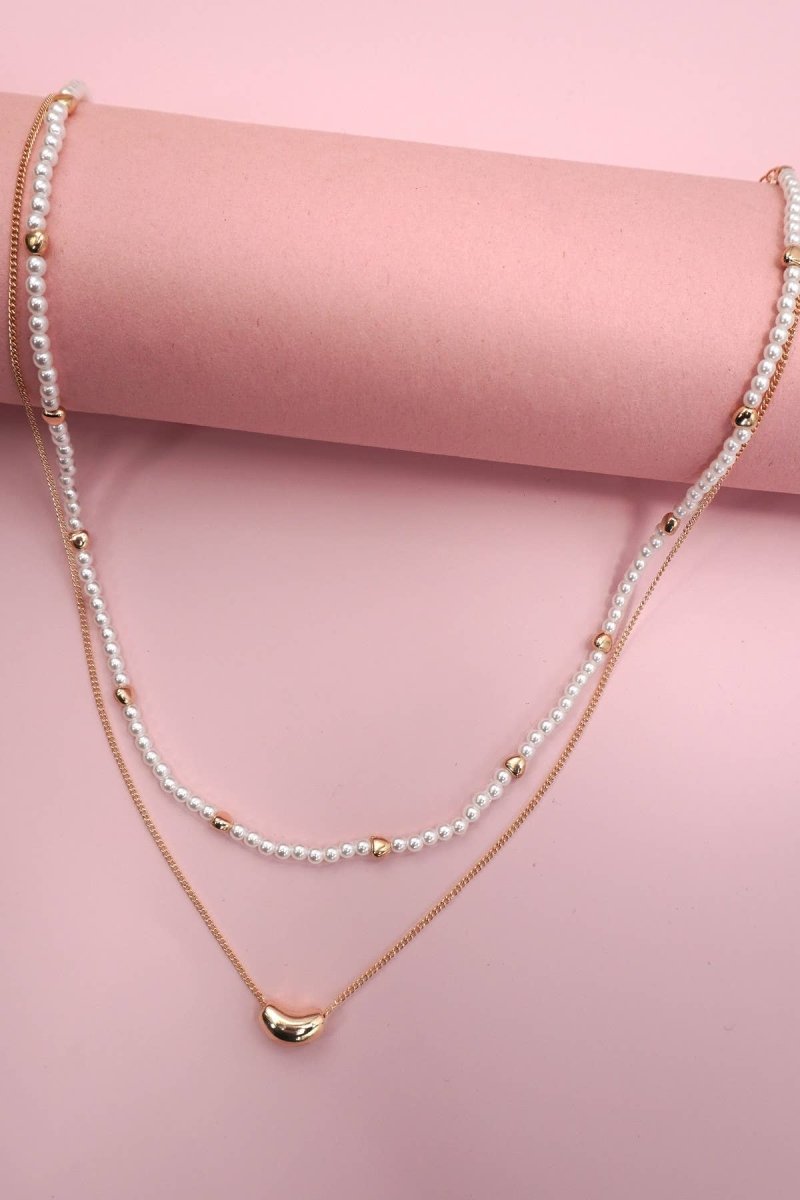 Double layer pearl and gold chain necklace with bean charm