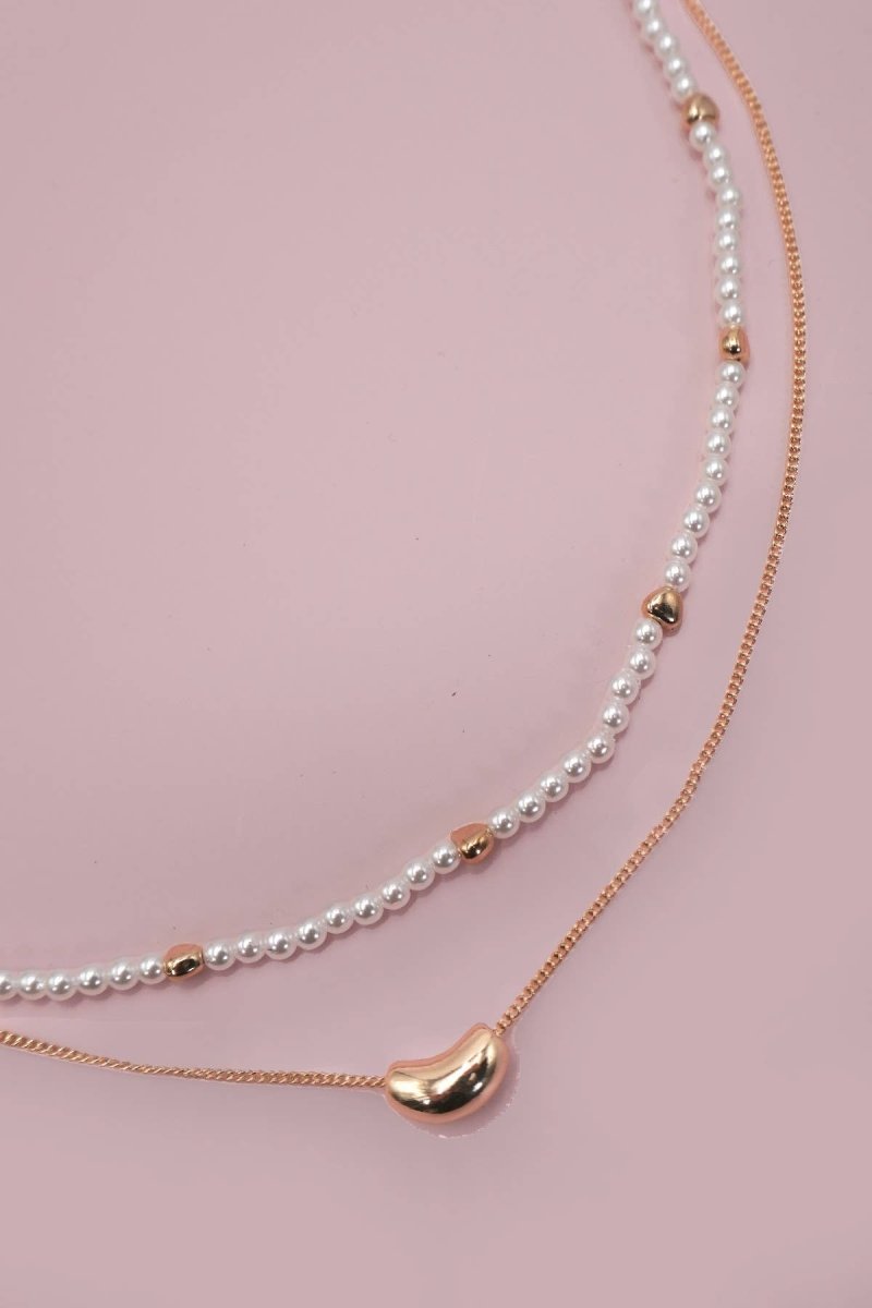 Double layer pearl and gold chain necklace with bean charm